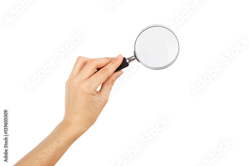 Magnifying glass in the hand, isolated