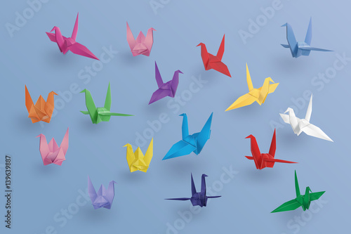 set of paper birds on blue background.the art of origami