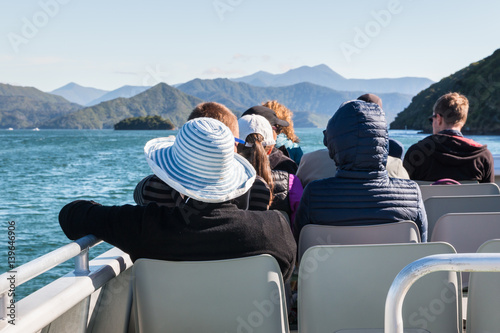 tourists on boat cruise in Marlborough Sounds, New Zealand
