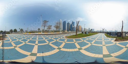 360 degrees spherical panorama of the abu dhabi (UAE) corniche with view of the skyline an blue water
