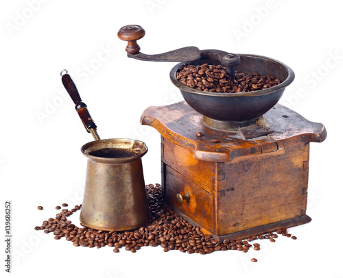  coffee grinder and roasted coffee beans isolated on white background