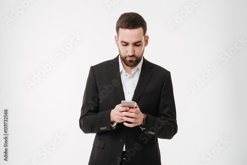 Handsome businessman chatting by mobile phone.
