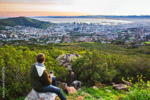 Tourist enjoying view of Cape Town after morning walk