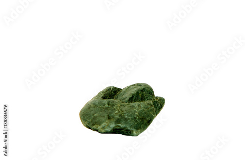 Green jasper stone isolated on white background close-up. Macro photography of cryptocrystalline rocks. 