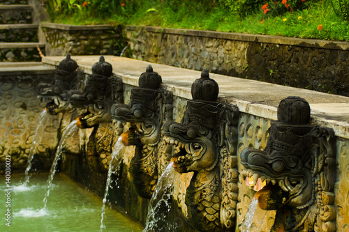 Balinese Thermal Hot Spring Fountains Heads in Bali, Indonesia