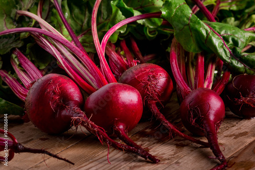 Organic Beetroot. Dark Red Beetroot on wooden background. 