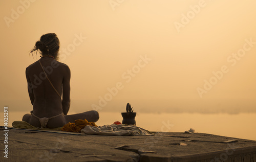 Yogi in India in the city of Varanasi, the embankment of the Ganges