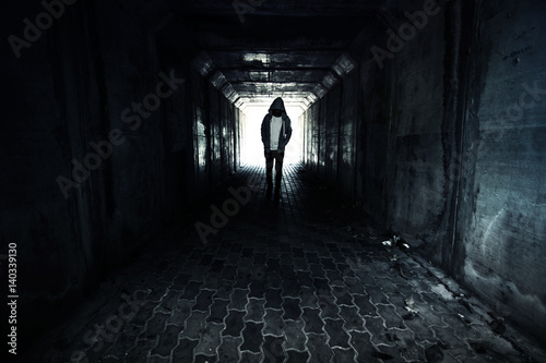 Homeless person walking on the street ,Stranger person in tunnel