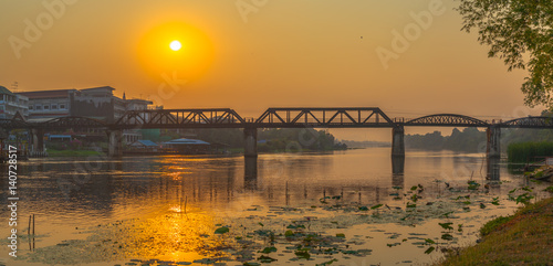 sunrise above River Kwai bridge