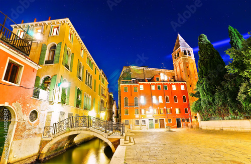 View of the Venetian houses along the canal in Venice at night