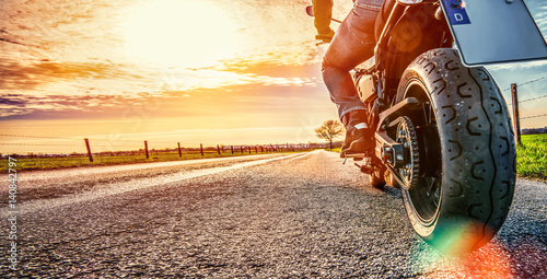 motorbike on the road riding. having fun riding the empty road on a motorcycle tour / journey