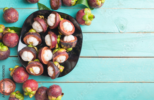 Mangosteen fruit on wooden background,top view