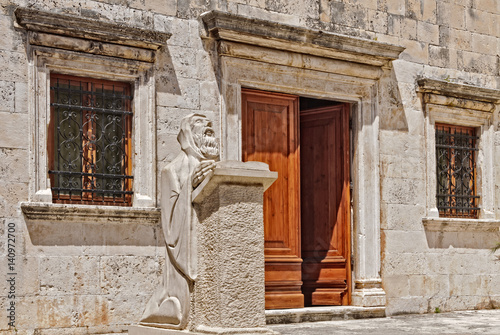 Sculpture of Renaissance playwright and poet Hanibal Lucic (Lučić) in front of the Benedictine monastery in Hvar, Croatia