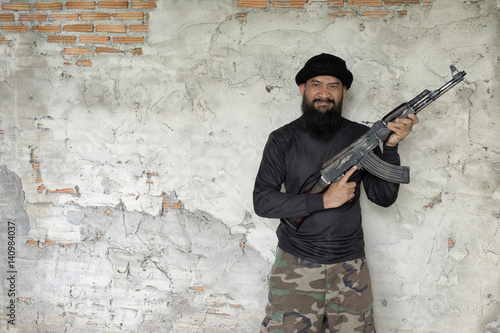 terrorist in black uniform and mask with kalashnikov