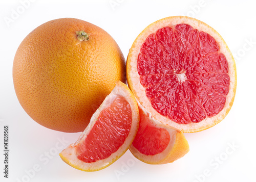 Pieces of pink grapefruit over white background