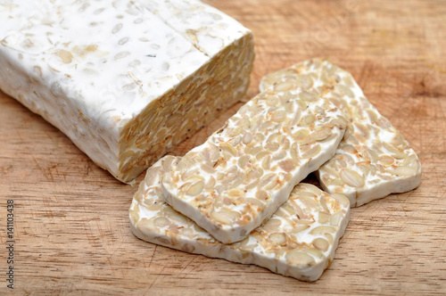 Sliced Fresh Tempeh on Wooden Board