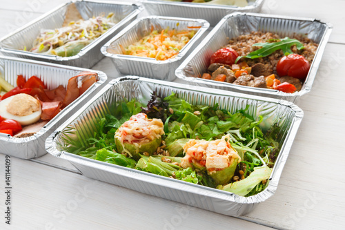 Healthy food take away in foil boxes, meat and vegetables