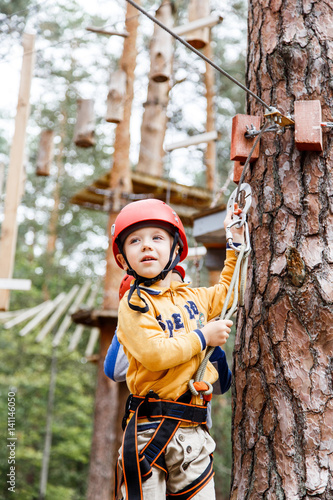 brave little boy having fun at adventure park