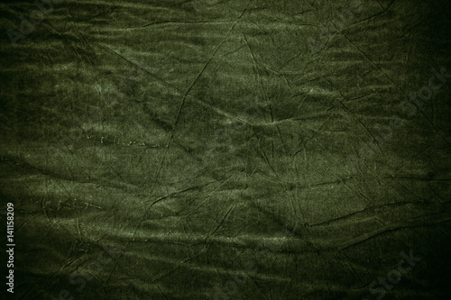 Texture of dark khaki crumpled fabric
