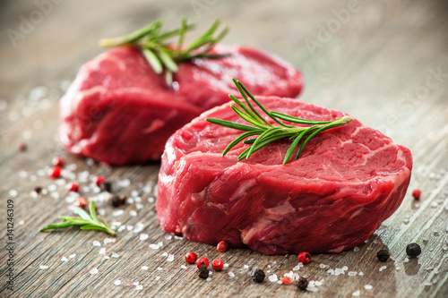 Raw beef fillet steaks with spices