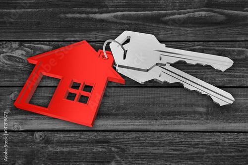 Haus - Schlüsselbund rot mit Schlüsseln - Hintergrund Holz