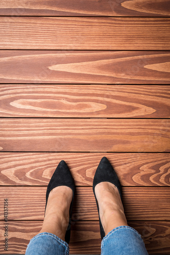 Woman standing on wooden floor