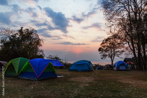 Camping tent with light sunrise morning