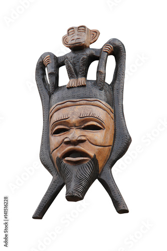 A Carved Tribal Wooden Face Mask and Monkey.
