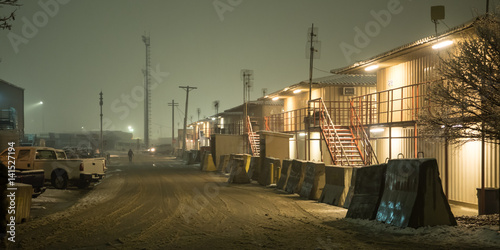 Barracks on military installation in Afghanistan during snow in winter at Night