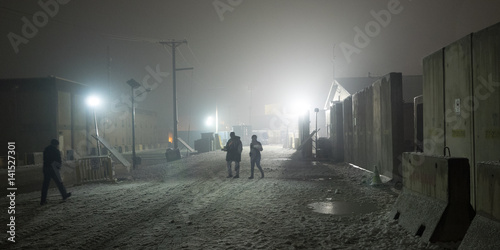 Nightly walk to chow hall on Afghanistan military installation during snow