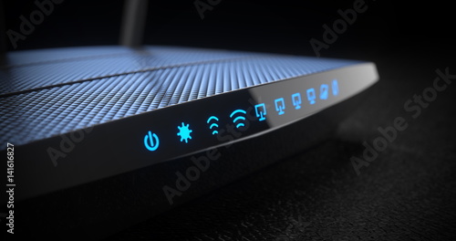 Wi-Fi wireless internet router on dark background