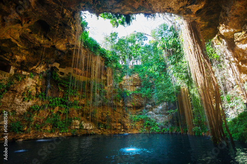 Sunbeams penetrating at Ik-Kil cenote inlet