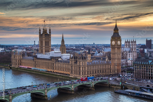 London, England - The famous Big Ben with Houses of Parliament and Westminster Bridge at sunset