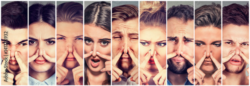 Group of people pinching nose with fingers something stinks bad smell