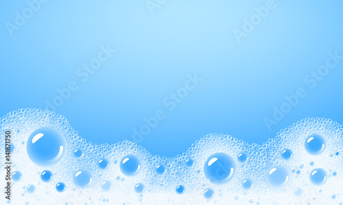 Soap foam overlying on the background of a blue water color