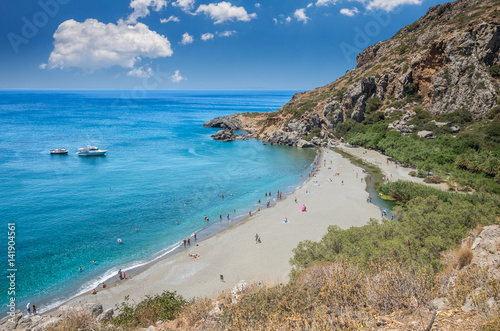 Preveli Beach in Crete island, Greece. There is a palm forest and a river inside the gorge near this beach.
