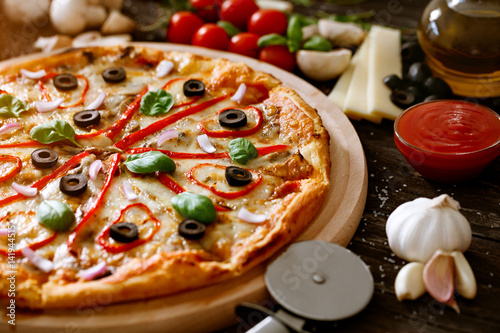 Pizza fast food - ingredients Italian cuisine .