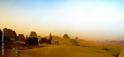 Panorama of Meroe pyramids in the desert at sunset in sand dust , Sudan,