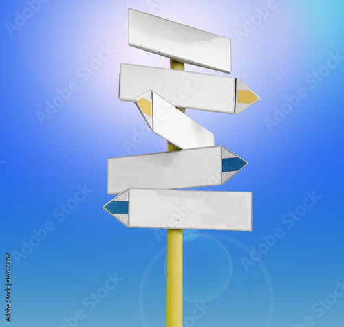 Signpost against the blue sky