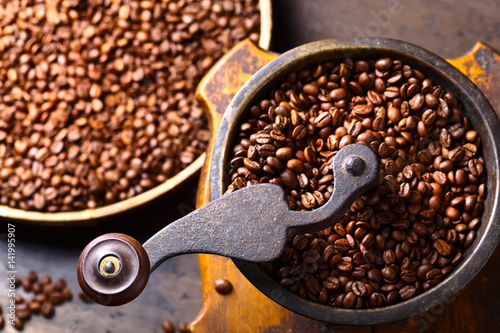 close-up of old coffee grinder and roasted coffee beans