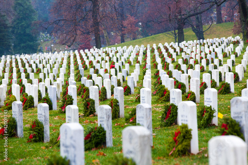 Gravestones with Christmas wreaths in Arlington National Cemetery - Washington DC United States