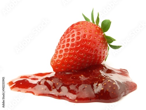 Strawberry jam with berry on white background
