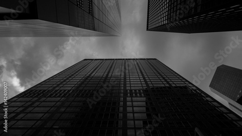 Bottom view at skyscrapers in black and white