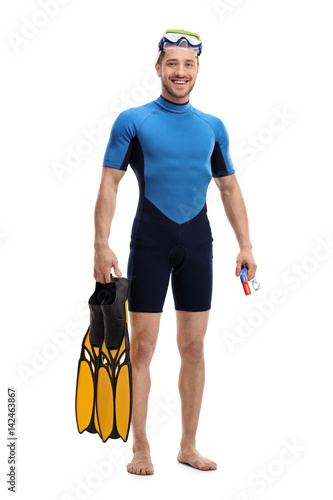 Guy in a wetsuit with snorkeling equipment