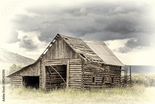 old rustic log barn in Rocky Mountains