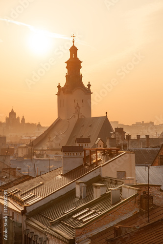 Roofs of old houses and Latin Cathedral at sunset, downtown Lviv, Ukraine