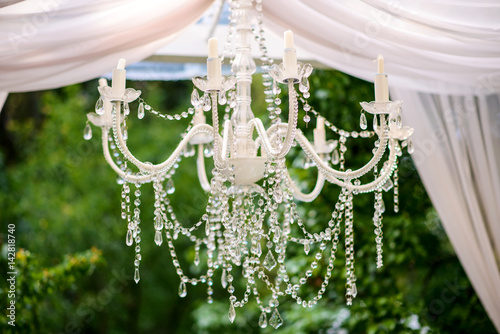 luxury chandelier in the gazebo in the garden