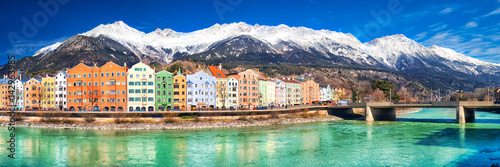 City scape in Innsbruck city center with beautiful houses, river Inn and Tyrolian Alps, Austria, Europe.