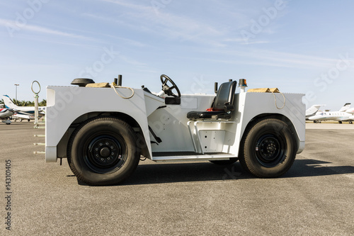 White Airplane Tugs Tow Tractors on runway, Engineered to meet the needs of today’s regional airline, corporate flight departments, FBO