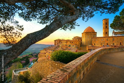 Tuscany, Volterra town skyline, church and trees on sunset. Italy